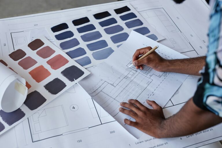 Planning office fit out layout with architectural drawings and colour swatches – design phase of office refurbishment