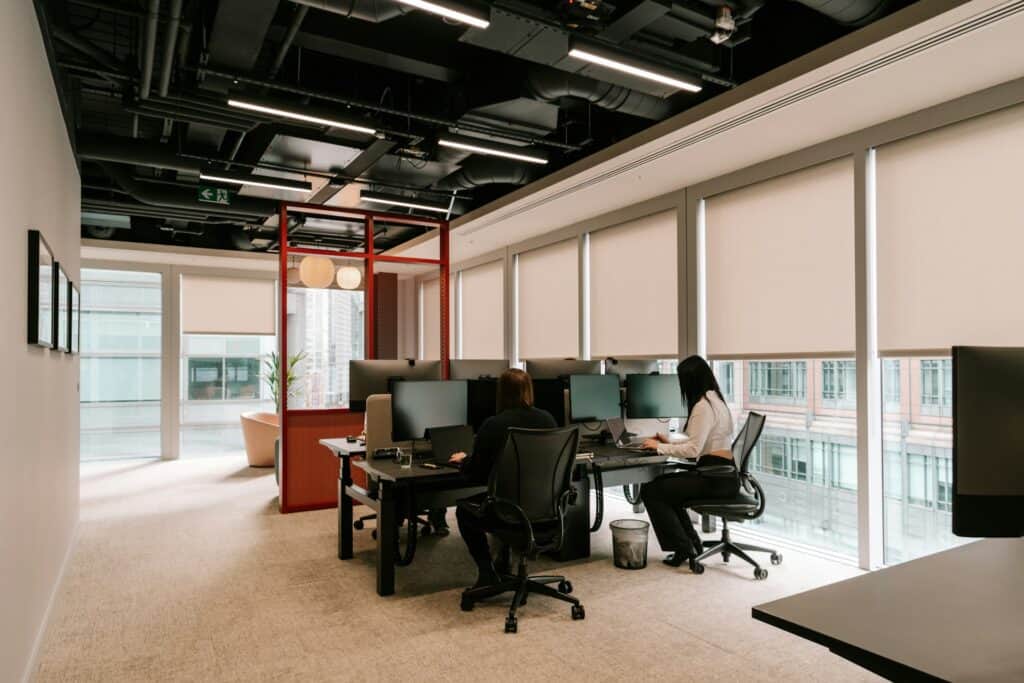 Modern open-plan office with ergonomic workstations and natural light – example of Cat B office fit out design