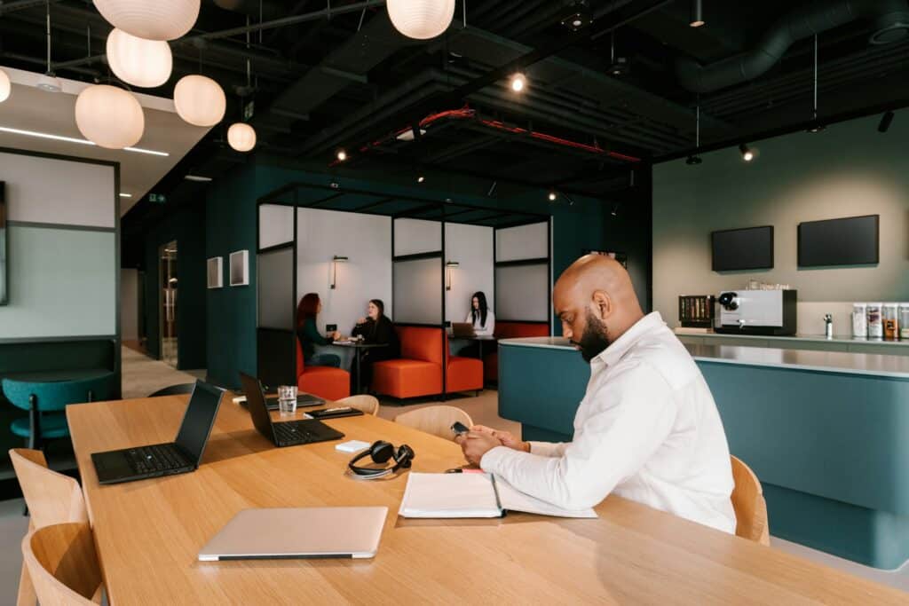 Modern breakout space with private pods and coffee area – office design supporting wellbeing and employee satisfaction