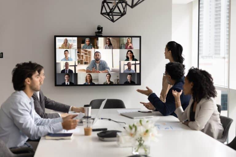 Smart office meeting room with video conferencing technology for SME business collaboration and remote team integration